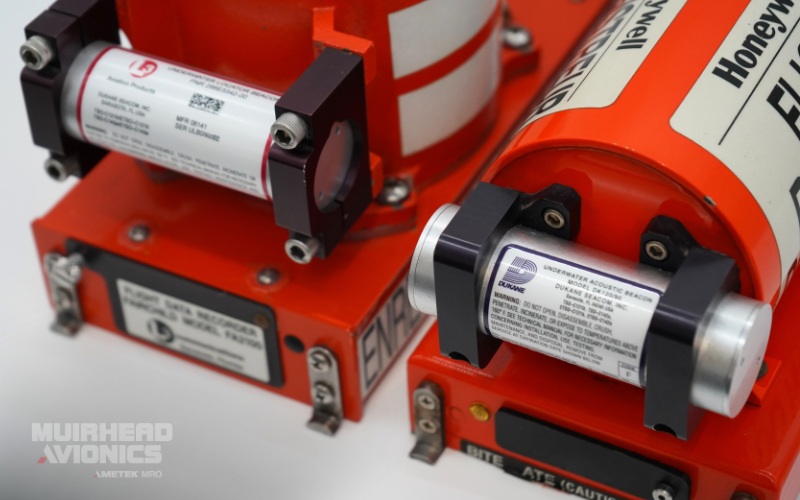 Two flight recorders side-by-side with underwater location beacons fitted at the front